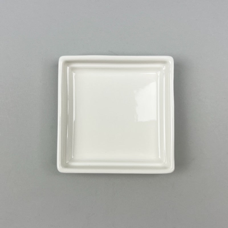4-inch square white ceramic dish, stackable, sturdy, ideal for appetizers, desserts, nuts, and condiments front shot
